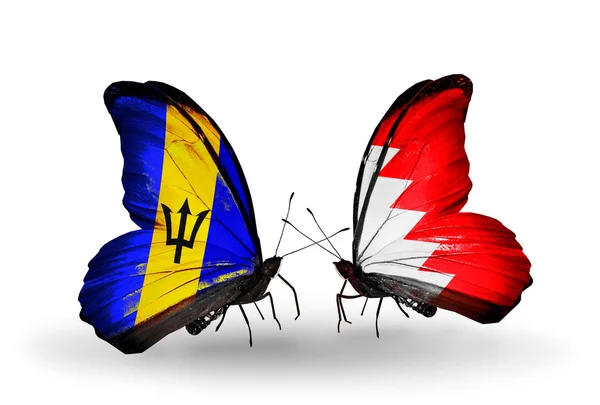 Butterflies with Barbados and Bahrain flags — Stock Photo, Image