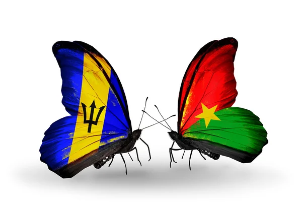 Barbados ve burkina faso bayrakları taşıyan kelebekler — Stok fotoğraf