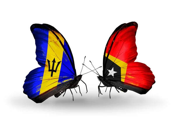 Butterflies with  Barbados and East Timor flags — Stock Photo, Image