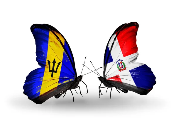 蝴蝶与巴巴多斯和多米尼加的国旗 — 图库照片