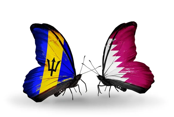 Butterflies with  Barbados and Qatar flags — Stock Photo, Image