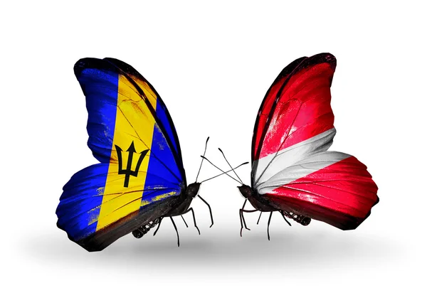 Butterflies with Barbados and Latvia flags — Stock Photo, Image