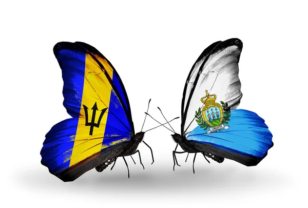 Butterflies with Barbados and San Marino flags — Stock Photo, Image