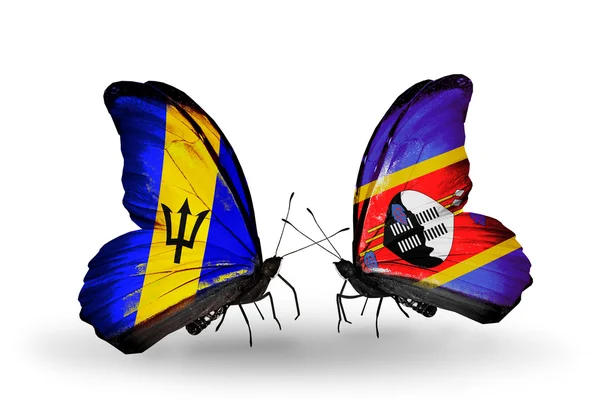 Бабочки с флагами Барбадоса и Свазиленда — стоковое фото