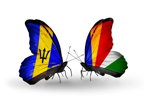 Mariposas con banderas de Barbados y Seychelles — Foto de Stock