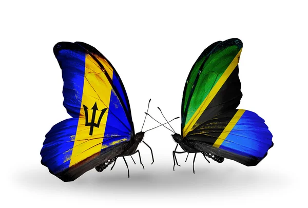 Farfalle con bandiere Barbados e Tanzania — Foto Stock