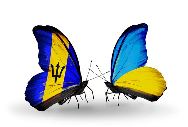 Farfalle con bandiere Barbados e Ucraina — Foto Stock