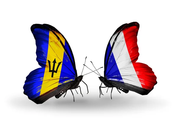 Butterflies with Barbados and  France flags — Stock Photo, Image