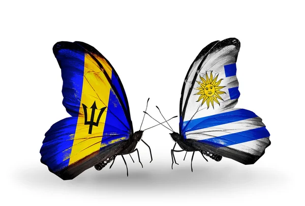 Mariposas con banderas de Barbados y Uruguay —  Fotos de Stock