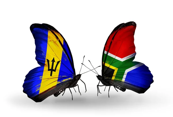 Farfalle con bandiere Barbados e Sudafrica — Foto Stock
