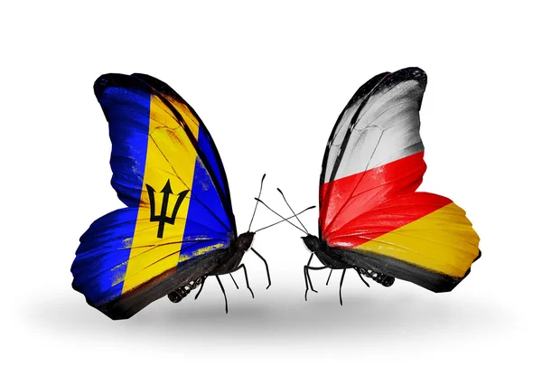 Butterflies with Barbados and South Ossetia flags — Stock Photo, Image