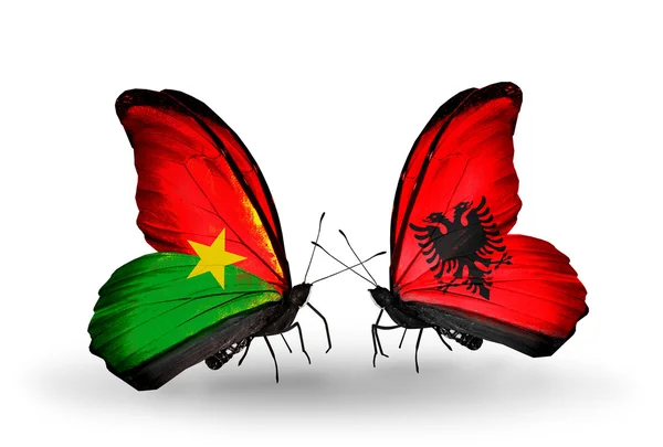 Two butterflies with flags — Stock Photo, Image