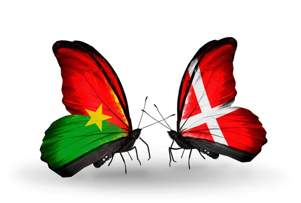 Two butterflies with flags — Stock Photo, Image