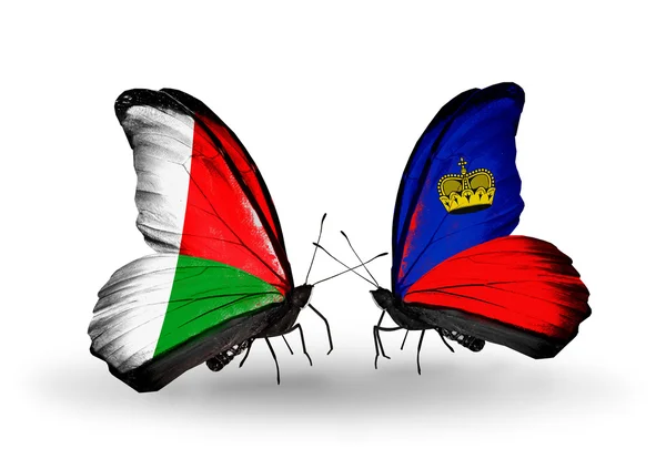 Two butterflies with flags — Stock Photo, Image