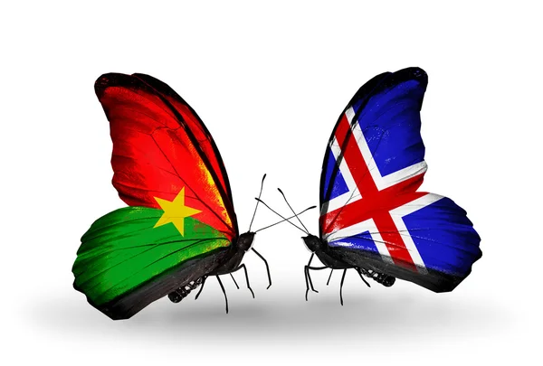 Two butterflies with flags — Stock Photo, Image