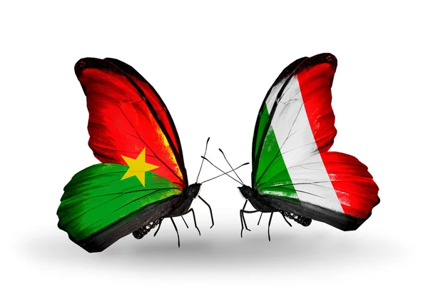 Two butterflies with flags — Stock Photo, Image