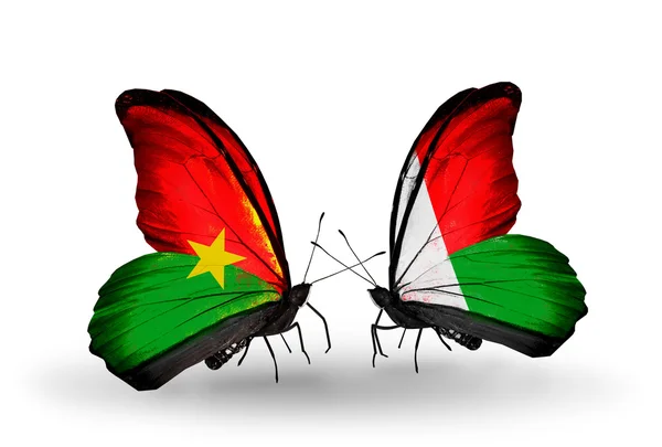 Duas borboletas com bandeiras — Fotografia de Stock