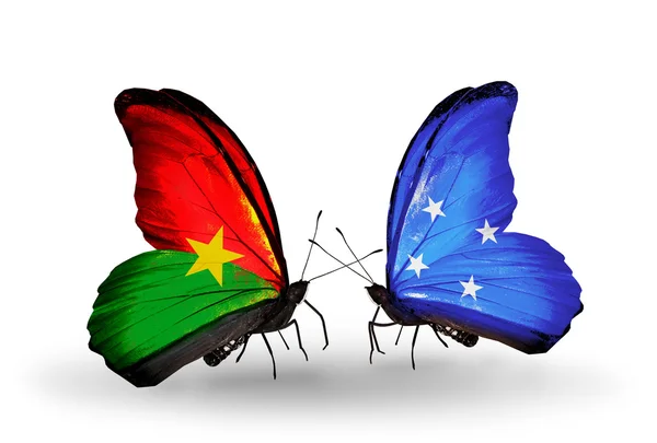 Two butterflies with flags — Stock Photo, Image