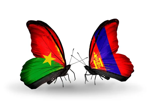 Two butterflies with flags — Stock Photo, Image