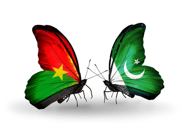 Two butterflies with flags — Stock Photo, Image