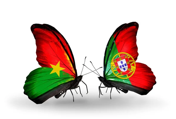 Two butterflies with flags — Stock Photo, Image