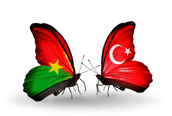 Two butterflies with flags — Stock Photo, Image