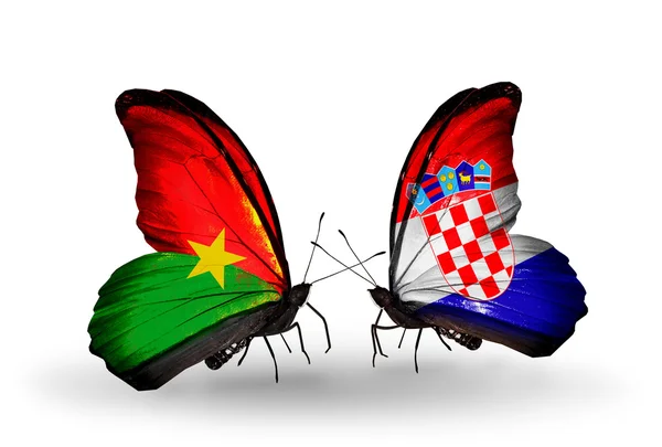 Two butterflies with flags — Stock Photo, Image