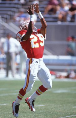 Greg Hill Kansas City Chiefs running back in pre-game warmups in 1990's NFL action.  Image taken from color slide.  clipart