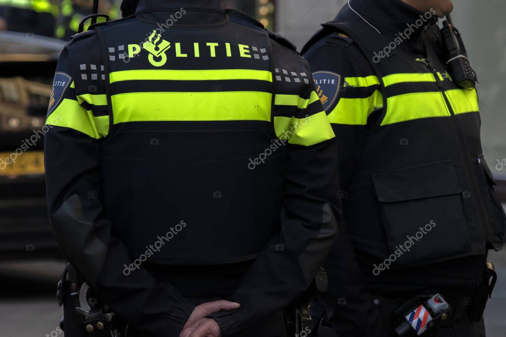 Close Up Two Police Men At Amsterdam The Netherlands 4-5-2020