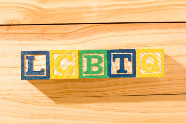 Spectacular colorful wooden cubes with the colors of the LGBTQ gay pride flag with the word LGBTQ