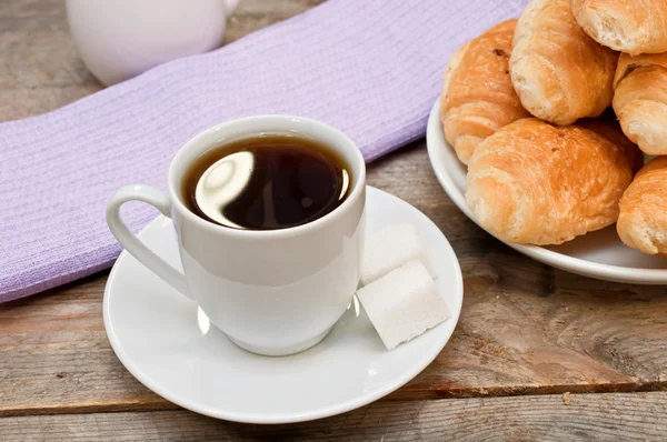 Coffee with croissants on the wooden table — Stock Photo, Image