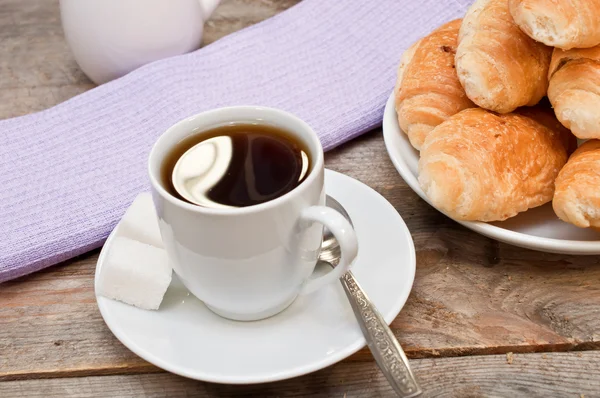 Coffee with croissants on the wooden table — Stock Photo, Image