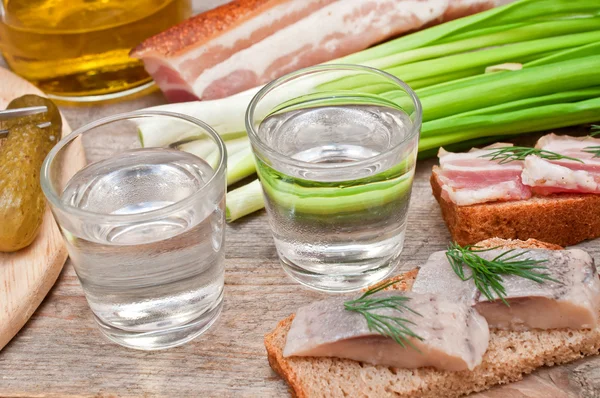 Two glasses of vodka and a snack — Stock Image Two glasses of vodka and a snack Stock Photo