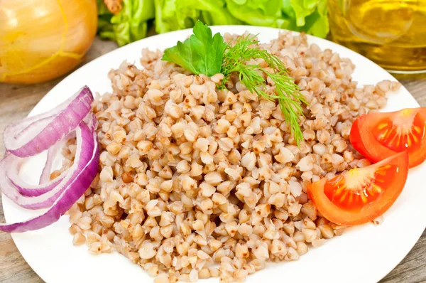 Buckwheat groats in a bowl — Stock Photo, Image