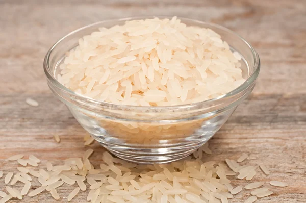 Rice cereal in a glass plate on wooden table — Stock Photo, Image