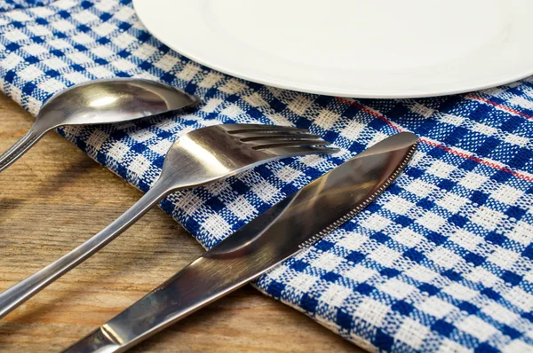 Cutlery and a white plate — Stock Photo, Image