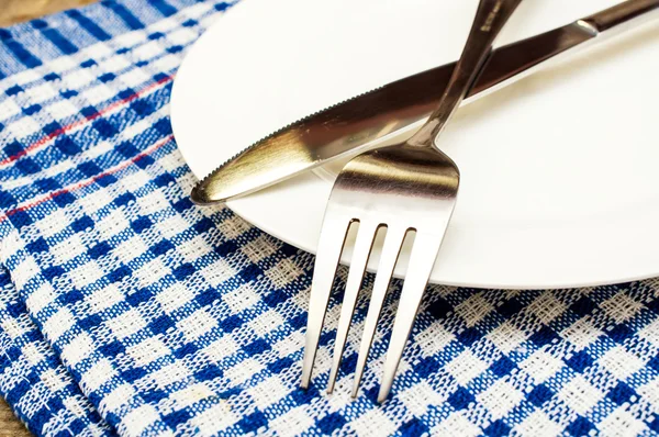 Cutlery on a plate — Stock Photo, Image