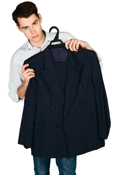 Young man holding a jacket on a hanger isolated — Stock Photo, Image