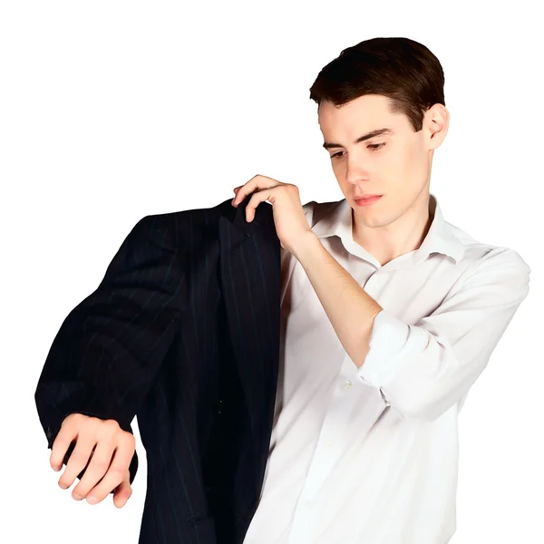 Ung man prova på en svart jacka — Stockfoto