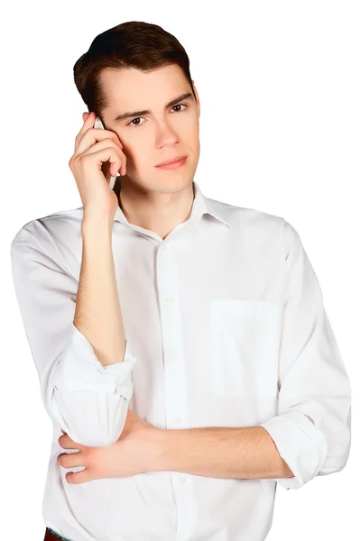 Ung man talar i en mobiltelefon som isolerade — Stockfoto
