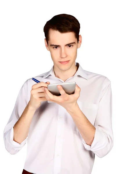 Young man writes a pen in notebook — Stock Photo, Image