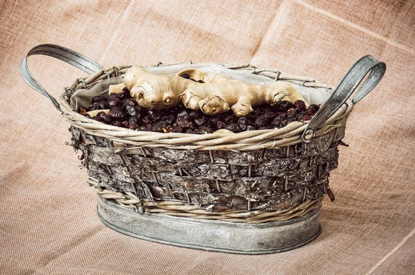 Dried rosehips and ginger arranged in the wicker tin basket, hea — Stock Photo, Image