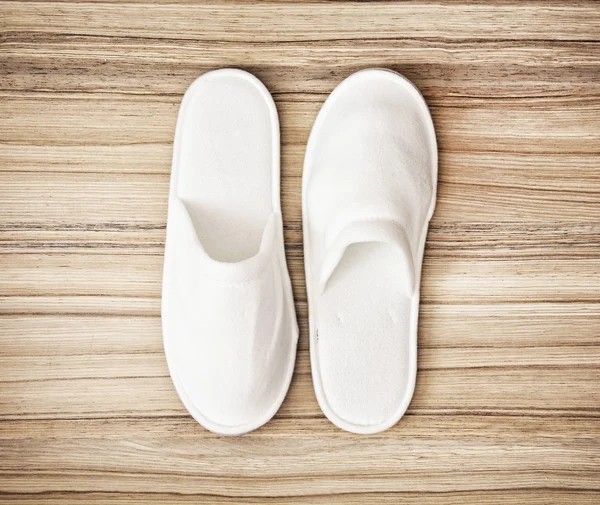 White slippers on the wooden background, retro style — Stock Photo, Image