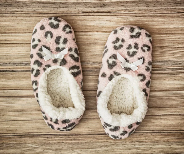 Wool slippers on the wooden background, beauty and fashion — Stock Photo, Image