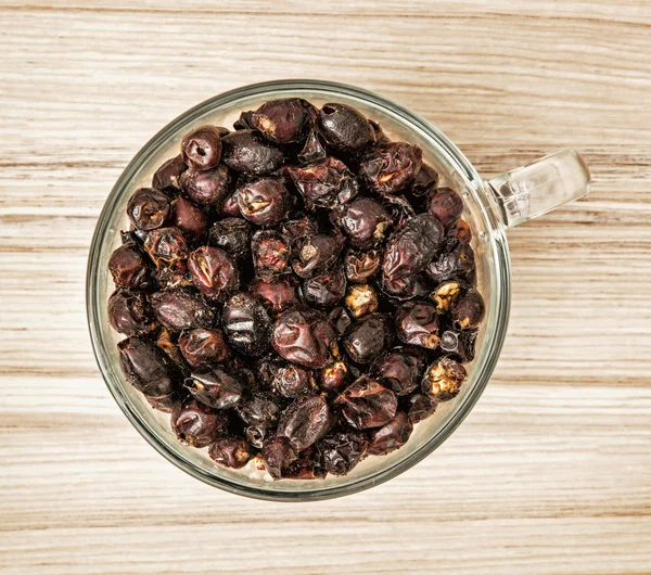 Dried rosehips in the glass bowl, healthy food — Stock Photo, Image