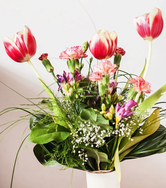 Bouquet of tulips, carnations and freesia, holiday symbol — Stock Photo, Image