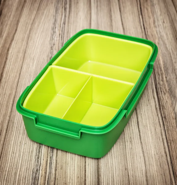 Caixa de comida de plástico verde, utensílio de cozinha — Fotografia de Stock