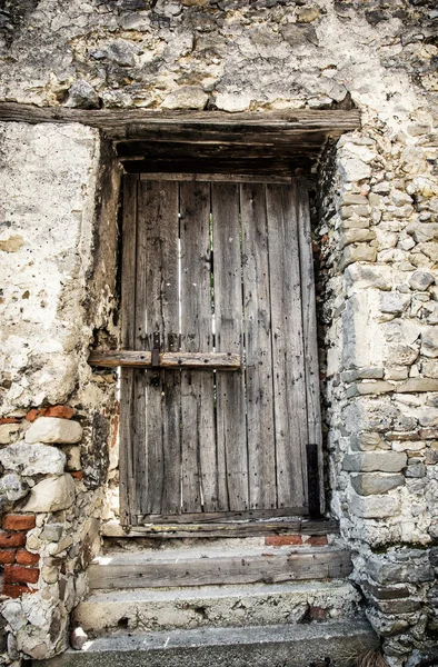 Old locked wooden doors, retro style — Stock Photo, Image