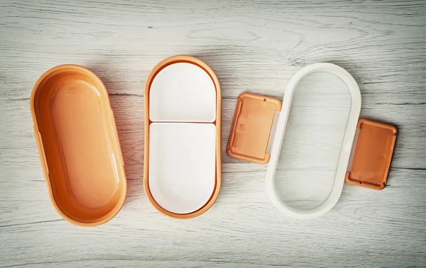 Orange folding plastic food box, view from above — Stock Photo, Image