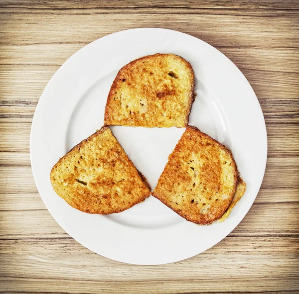 Three fried breads in the egg, food theme — Stock Photo, Image